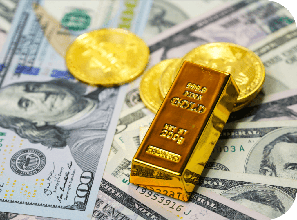 Gold bar and gold coins on hundred dollar bills used for a collateral loan.