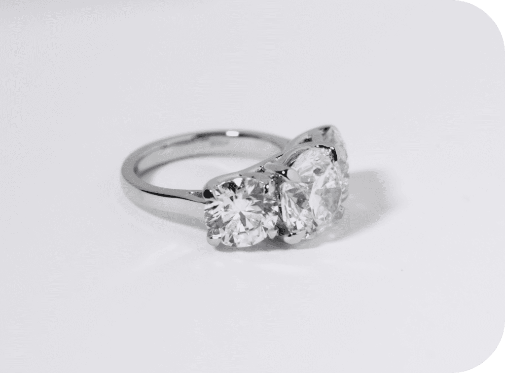 GIA-certified three-stone diamond engagement ring used for luxury collateral loan.