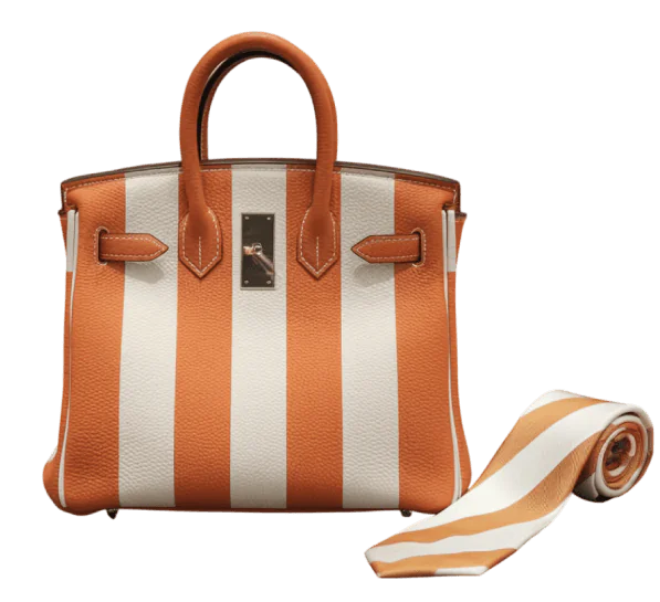 Orange and white Hermès Birkin bag with striped strap used for luxury collateral loan.