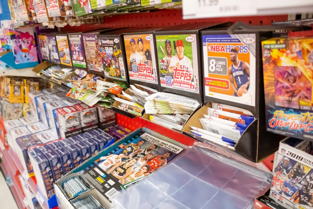 A retail store display featuring collectible trading card boxes, including baseball, basketball, and gaming cards—assets that can be used to secure a collateral loan.