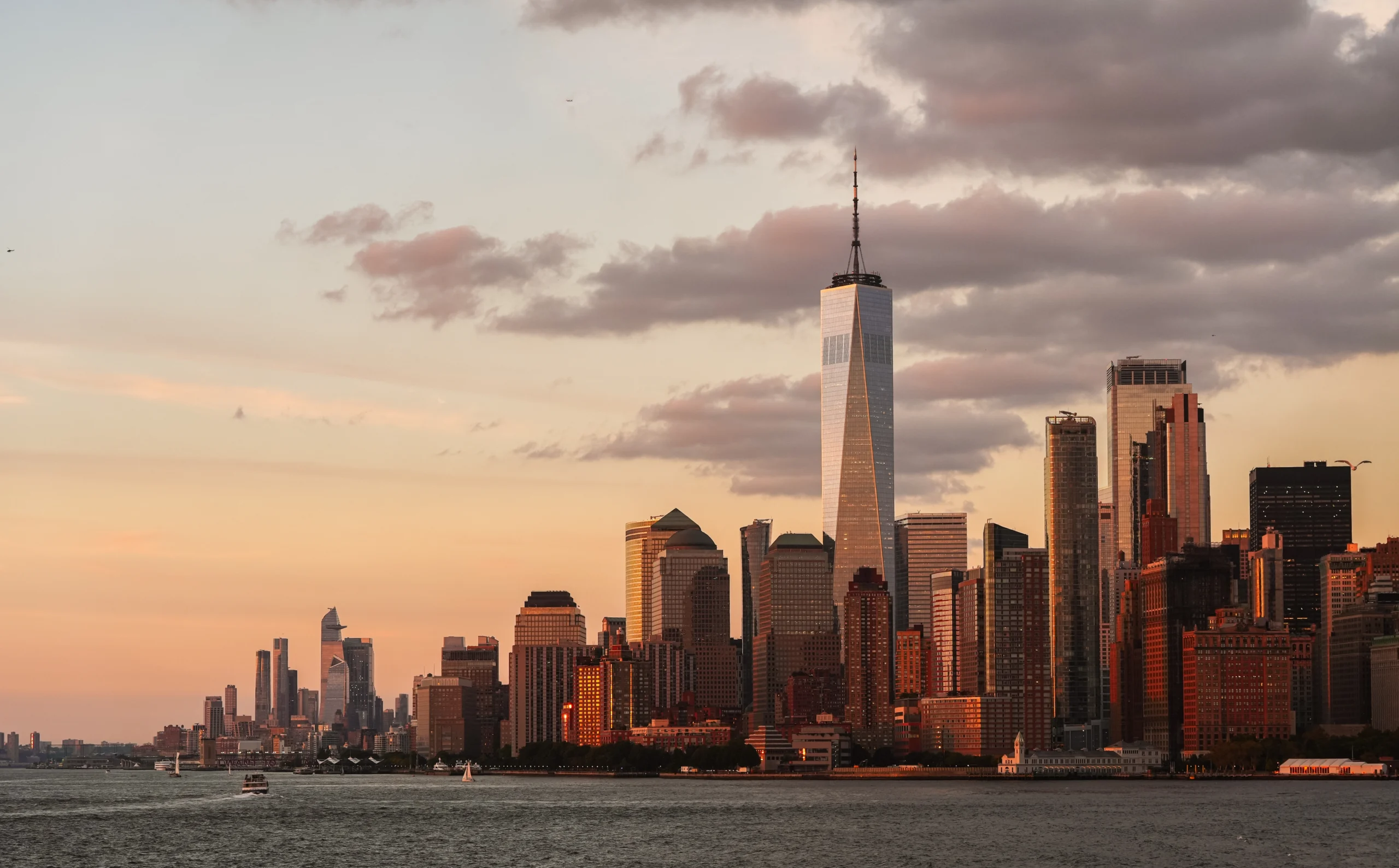 Manhattan skyline with One World Trade Center at sunset