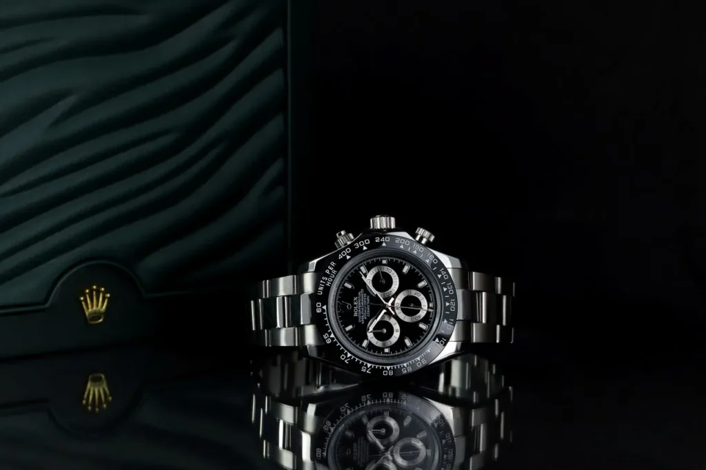 Rolex Daytona is one of the top investment watches for collateral at Qollateral, shown in front of original box.