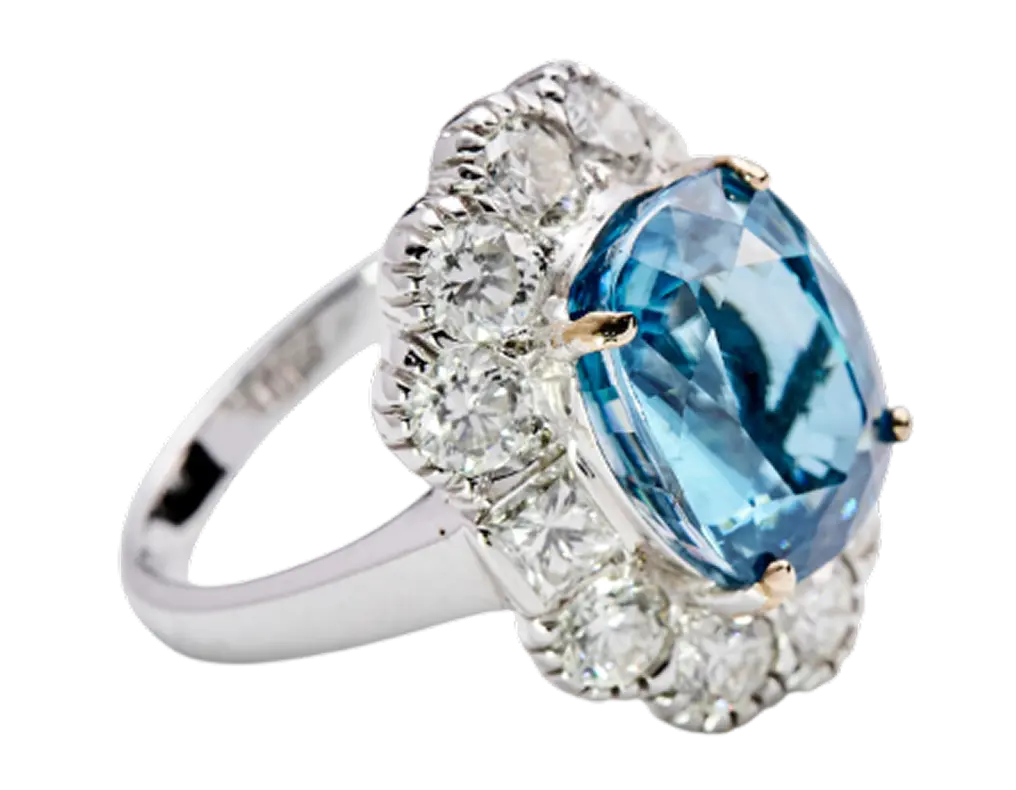 Oval-cut aquamarine and diamond halo ring in a white gold setting
